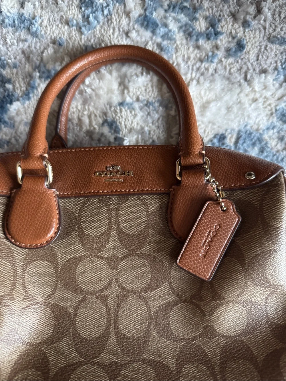 Coach women’s Tan Leather Crossbody Bag with Embossed Logo Patch